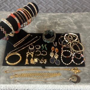 Lot of vintage goldtone jewelry. Bracelets,necklaces, and earrings,